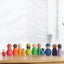 Montessori inspired Wooden colour sorting rings and mini figurines.  Early learning toy