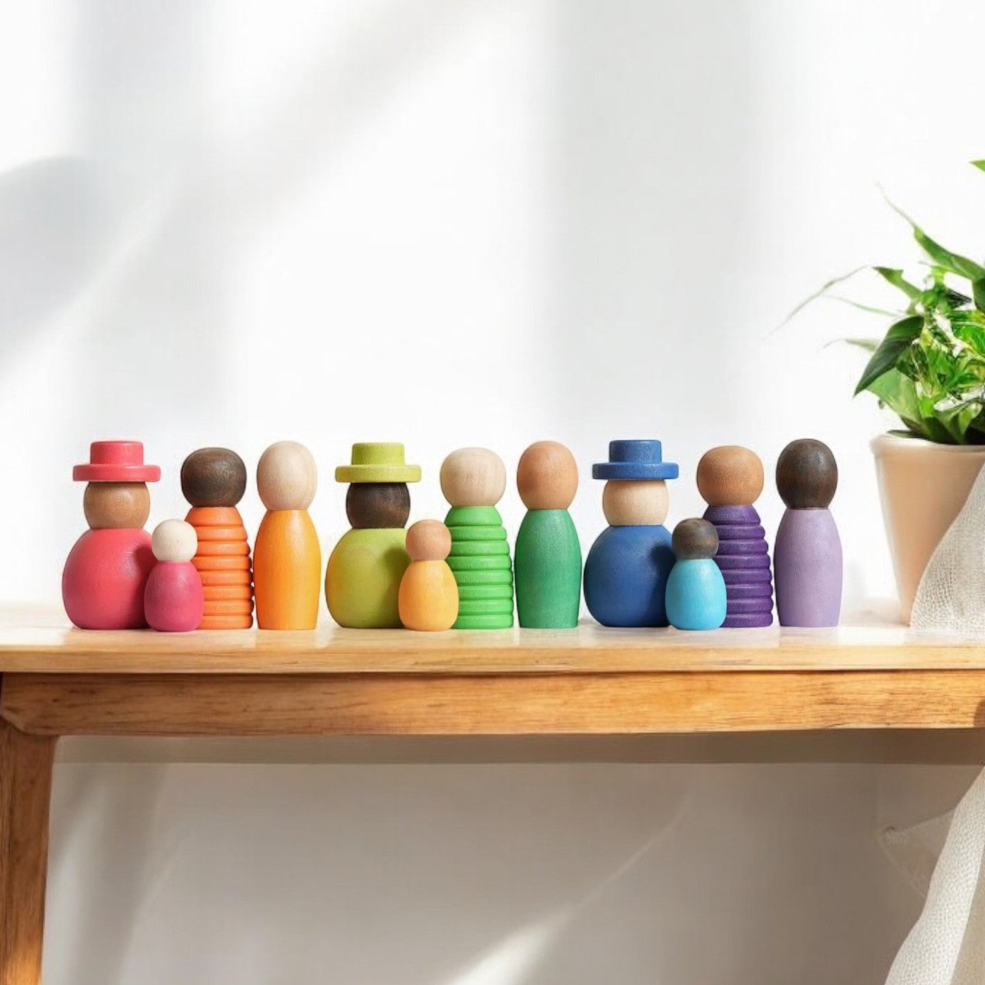 Montessori inspired Wooden colour sorting rings and mini figurines.  Early learning toy